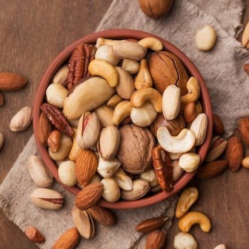 Premium Photo _ Arrangement of nuts in bowl